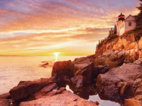 Bass Harbor Head Lighthouse in Acadia National Park at sunset as seen on a Tauck tour of foliage in the Northeast