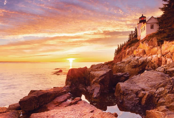 Bass Harbor Head Lighthouse in Acadia National Park at sunset as seen on a Tauck tour of foliage in the Northeast