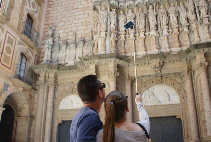 People taking a picture of themselves at Montserrat in Spain
