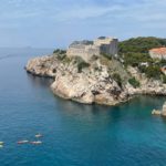 Adventures by Disney Adriatic Expedition Cruise in Dubrovnik kayaks in the shadow of a fortress