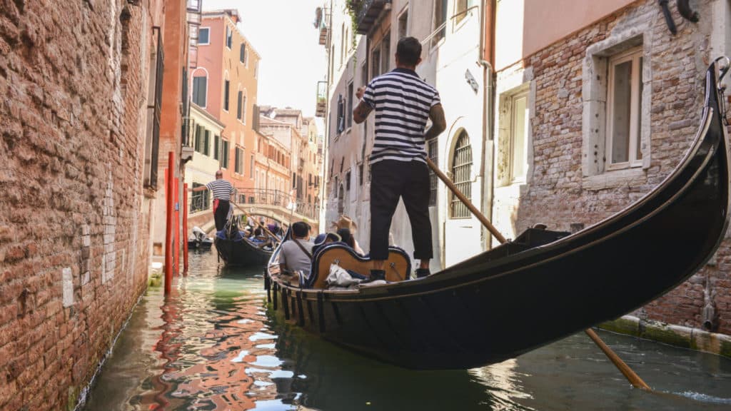 Guests on a Road Scholar Independent City tour in Venice on a gondola