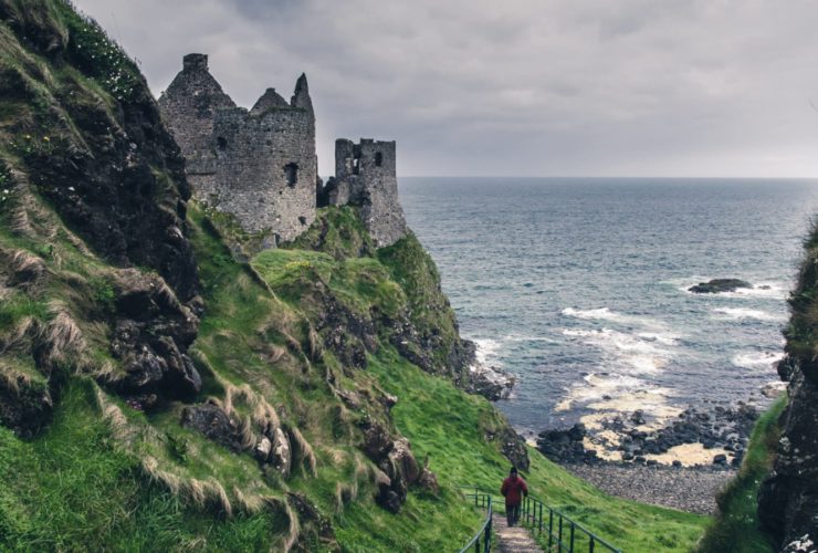 coastal landscape in Ireland with castle and green hills
