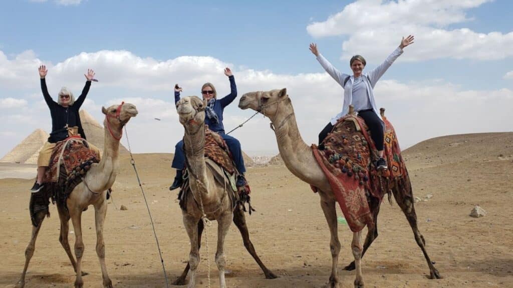 Women riding camels in Egypt on an AdventureWomen tour (Photo: AdventureWomen)