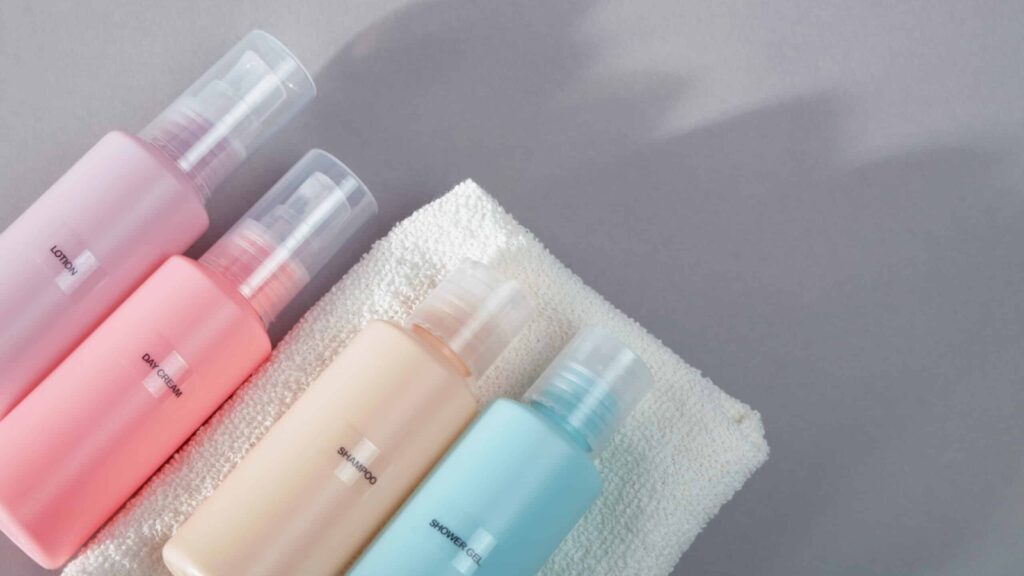 travel-sized toiletries bottles in a row
