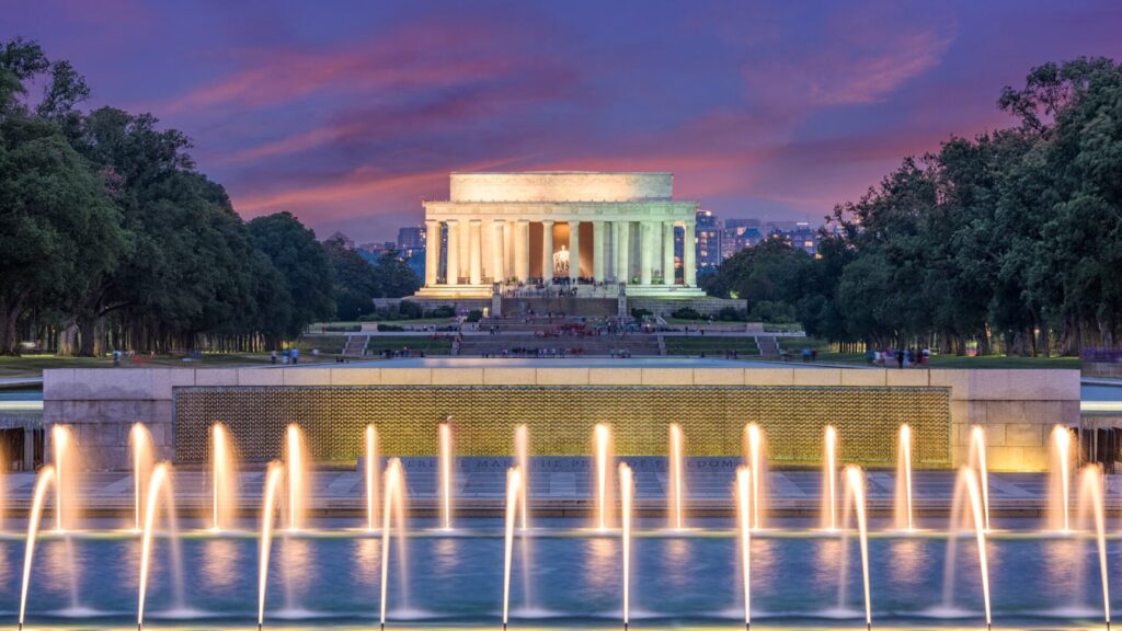 Lincoln Memorial in Washington, D.C. at night with fountains in foreground