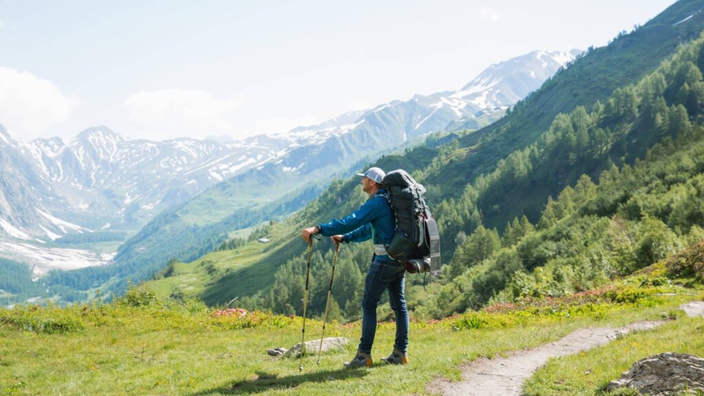 Backpacker on a hiking tour along the Tour du Mont Blanc