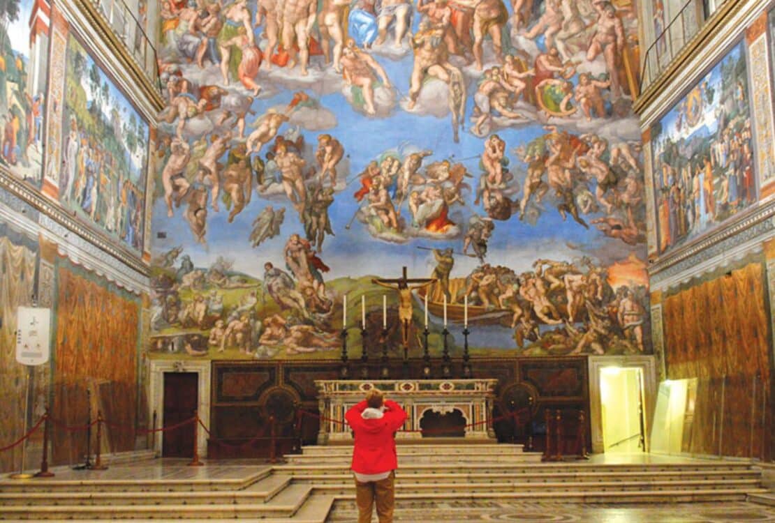 Tauck Tours traveler taking a picture in the Sistine Chapel