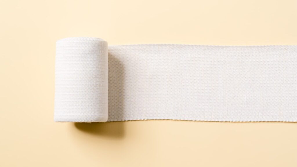 gauze partially unrolled on a table