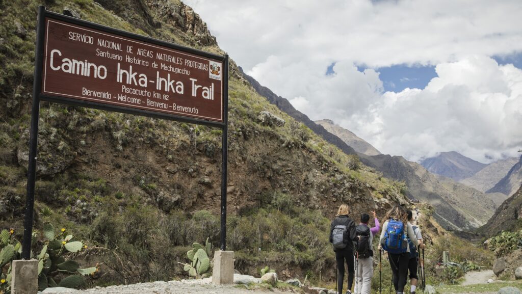 G Adventures tour group on the Peru Inca Trail at the 82km Welcome Sign
