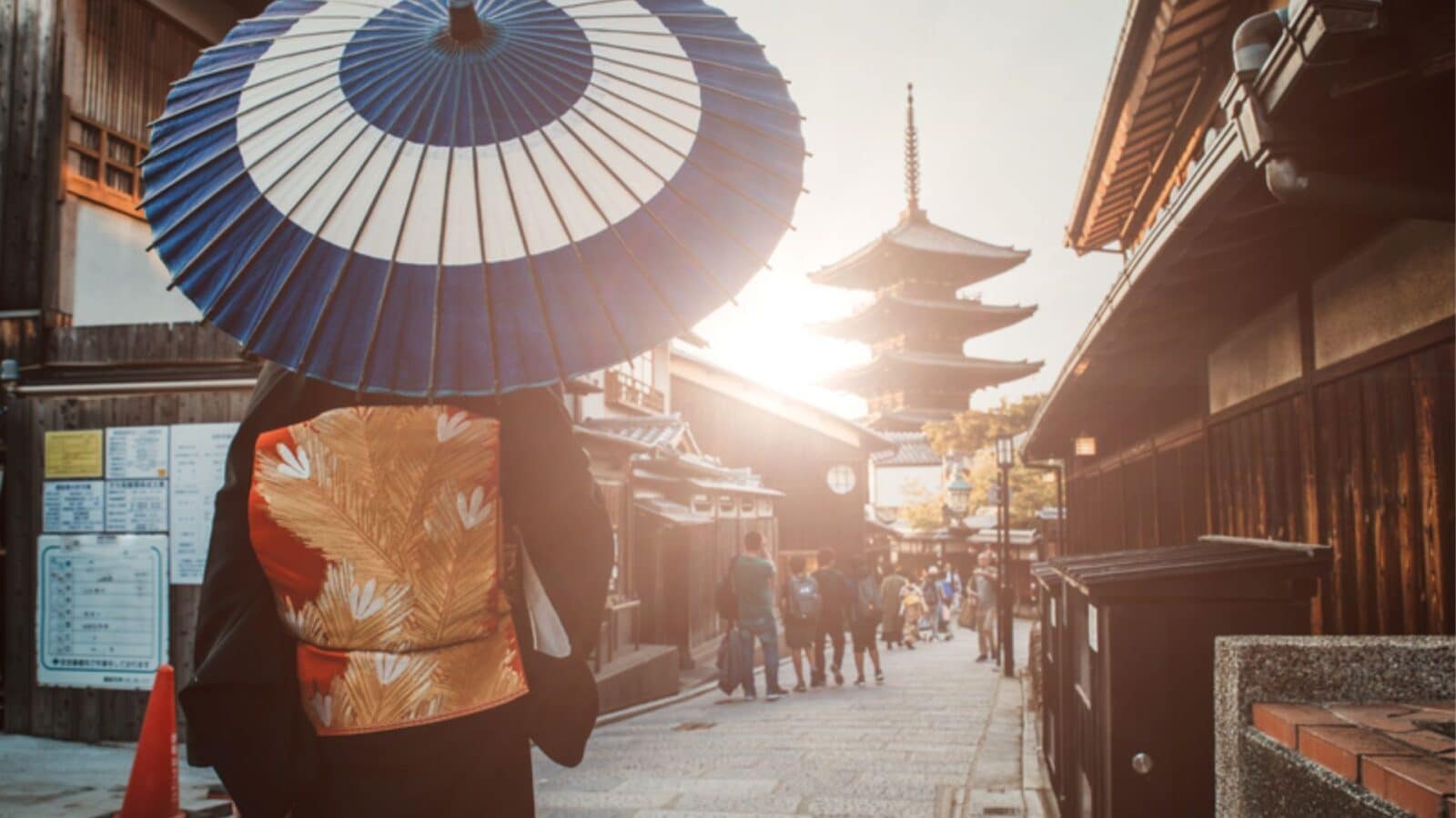 Hokan-ji Temple with woman in traditional dress walking down narrow street