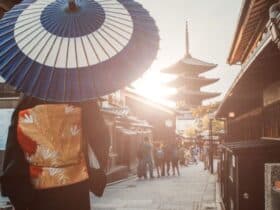 Hokan-ji Temple with woman in traditional dress walking down narrow street