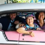 Road Scholar participants in an antique car in Havana on a Cuba tour