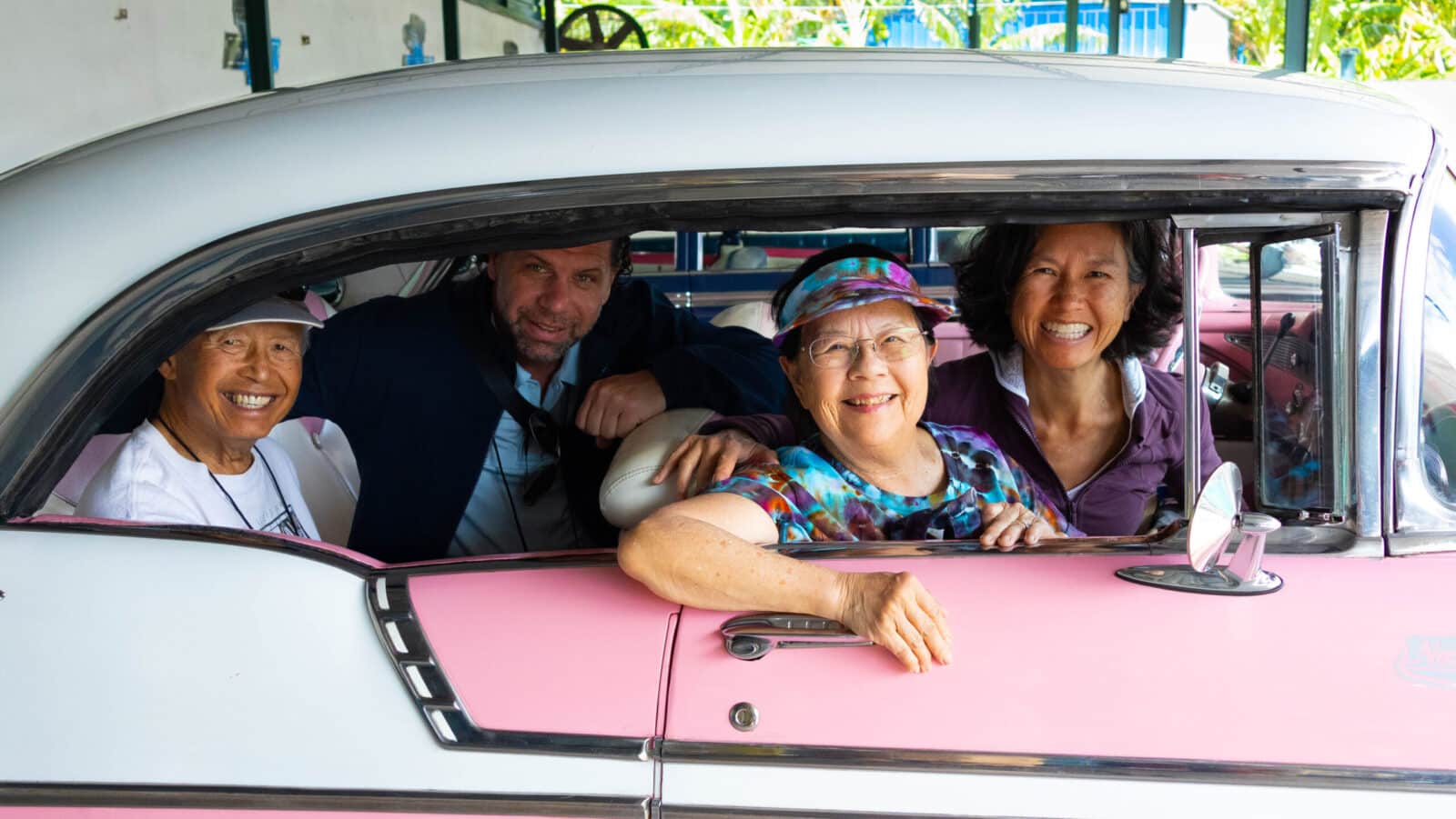 Road Scholar participants in an antique car in Havana on a Cuba tour