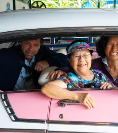 Road Scholar participants in an antique car in Havana on a Cuba tour