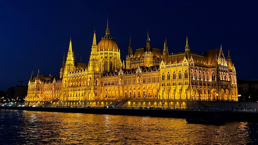 A nighttime view of the Parliament Building in Budapest