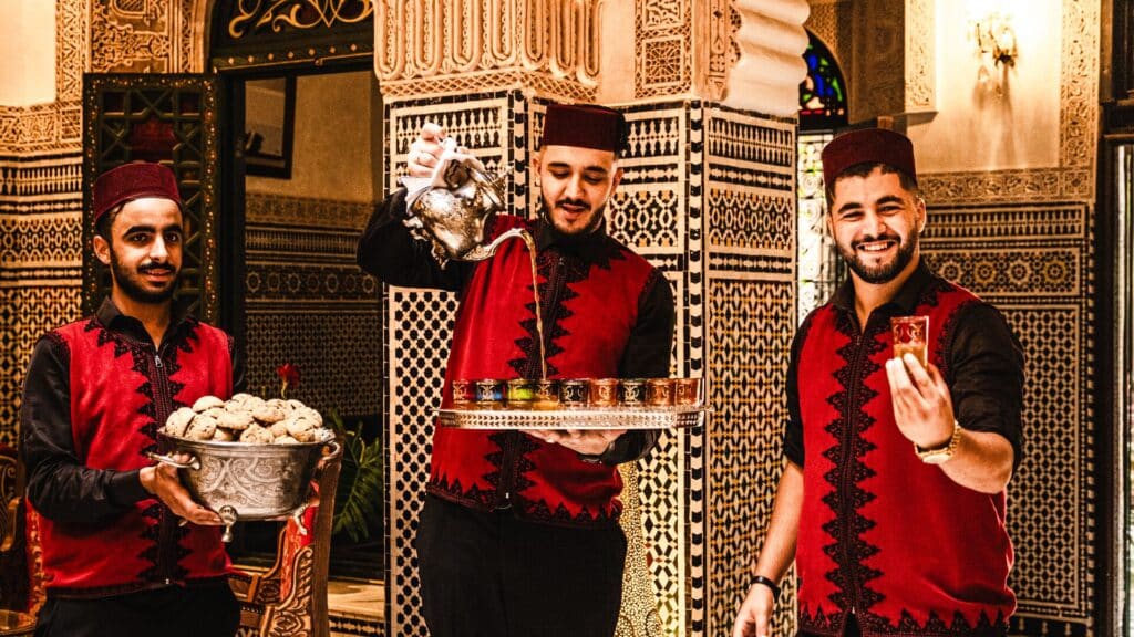 Mint tea being served in Fez, Morocco by three men