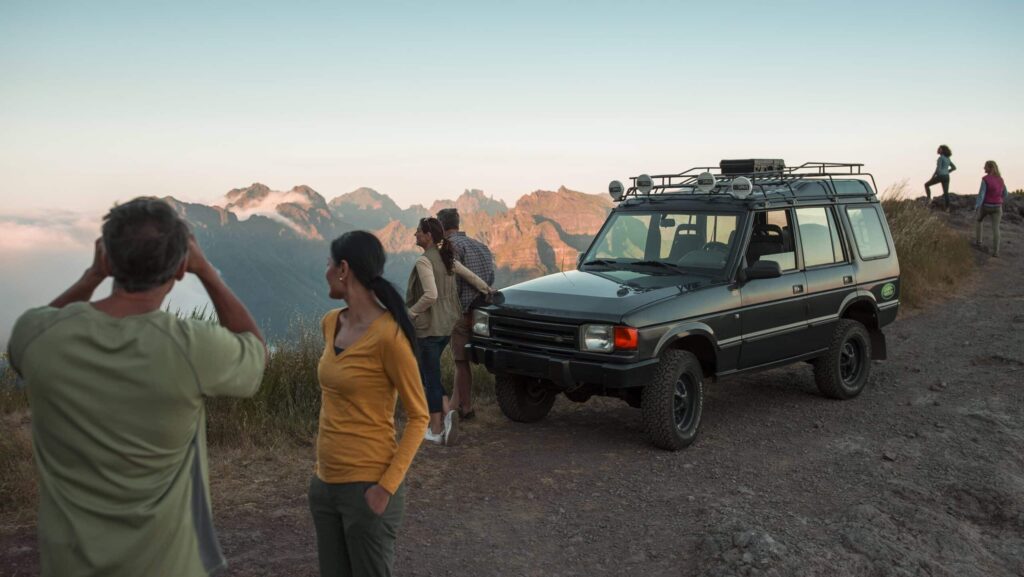 Globus tour guests at an overlook during a jeep tour