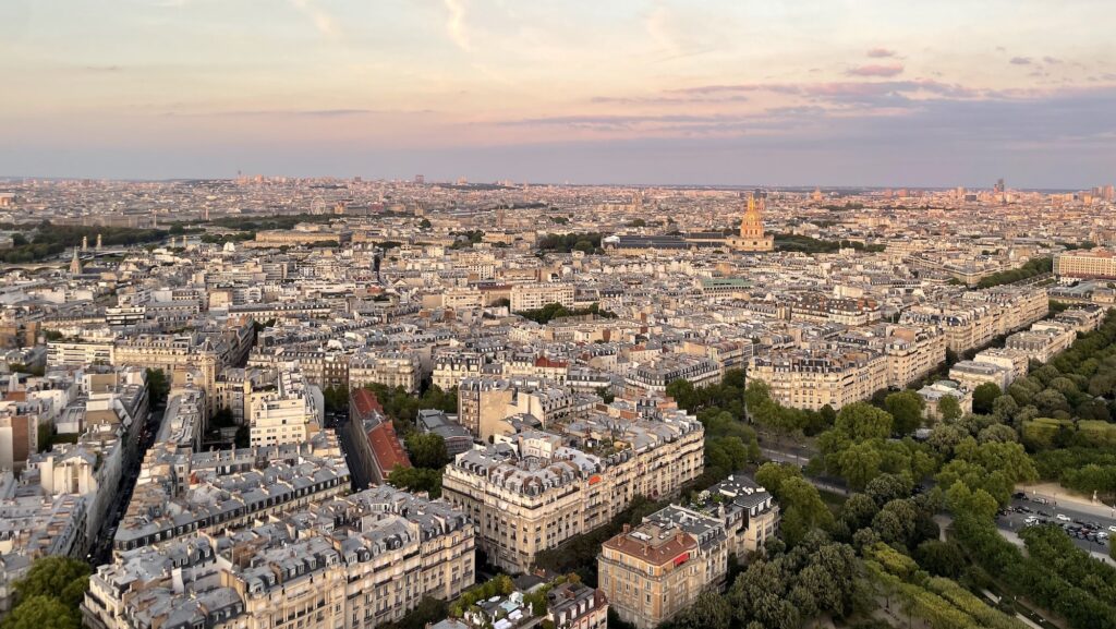 View of Paris at dusk from the second deck of the Eiffel Tower in summer