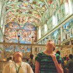 young people looking up at the SIstine Chapel on a tour with Tauck