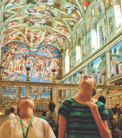 young people looking up at the SIstine Chapel on a tour with Tauck