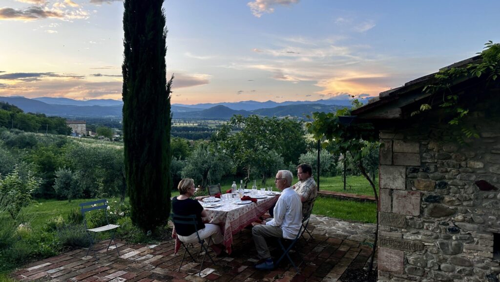 people having dinner outside in Italy