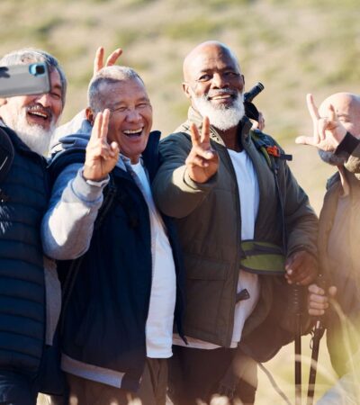 Senior hiking, mountain selfie and elderly friends in nature on a walk with freedom in retirement. .
