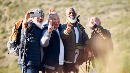 Senior hiking, mountain selfie and elderly friends in nature on a walk with freedom in retirement. .