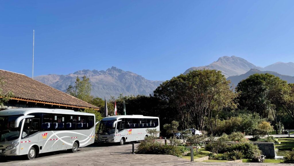 tour buses waiting to take tour guests sightseeing in Peru's Sacred Valley