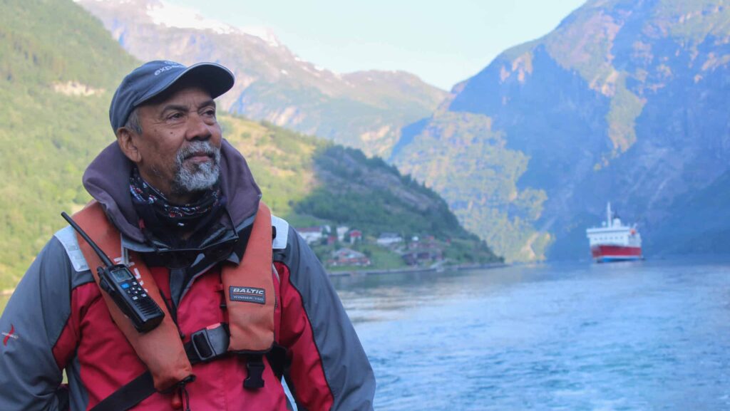 person with PFD and radio on G Adventures Norway Fjords tour