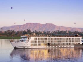 Uniworld S.S. Sphinx river ship in Egypt at sunrise with hot air balloons in background