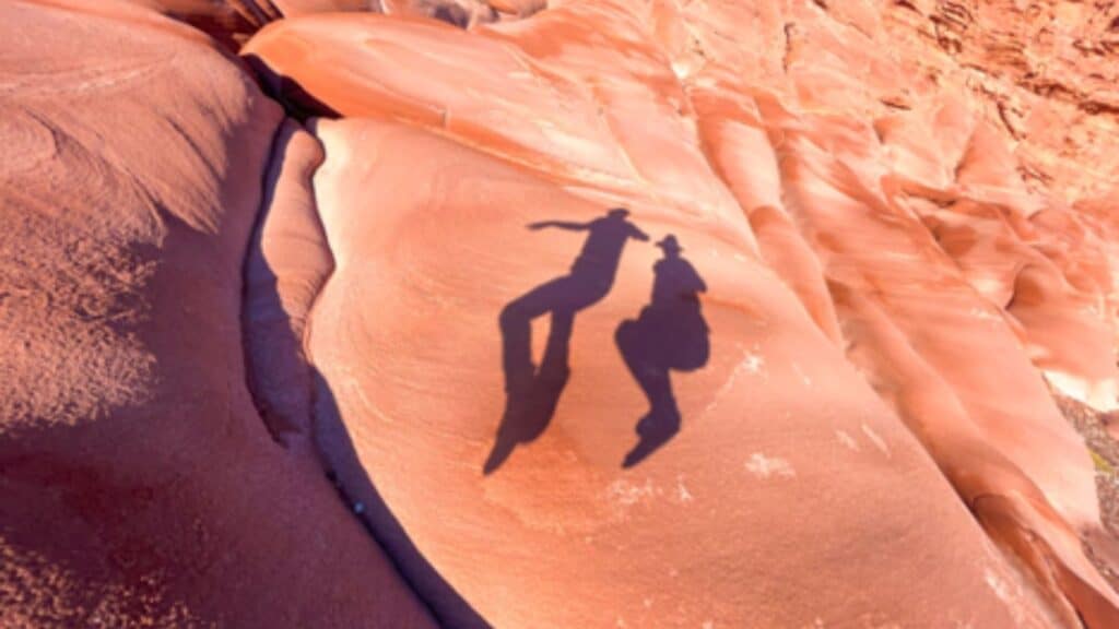 photo of two shadows seemingly floating against a backdrop of red rock in Baja California Sur
