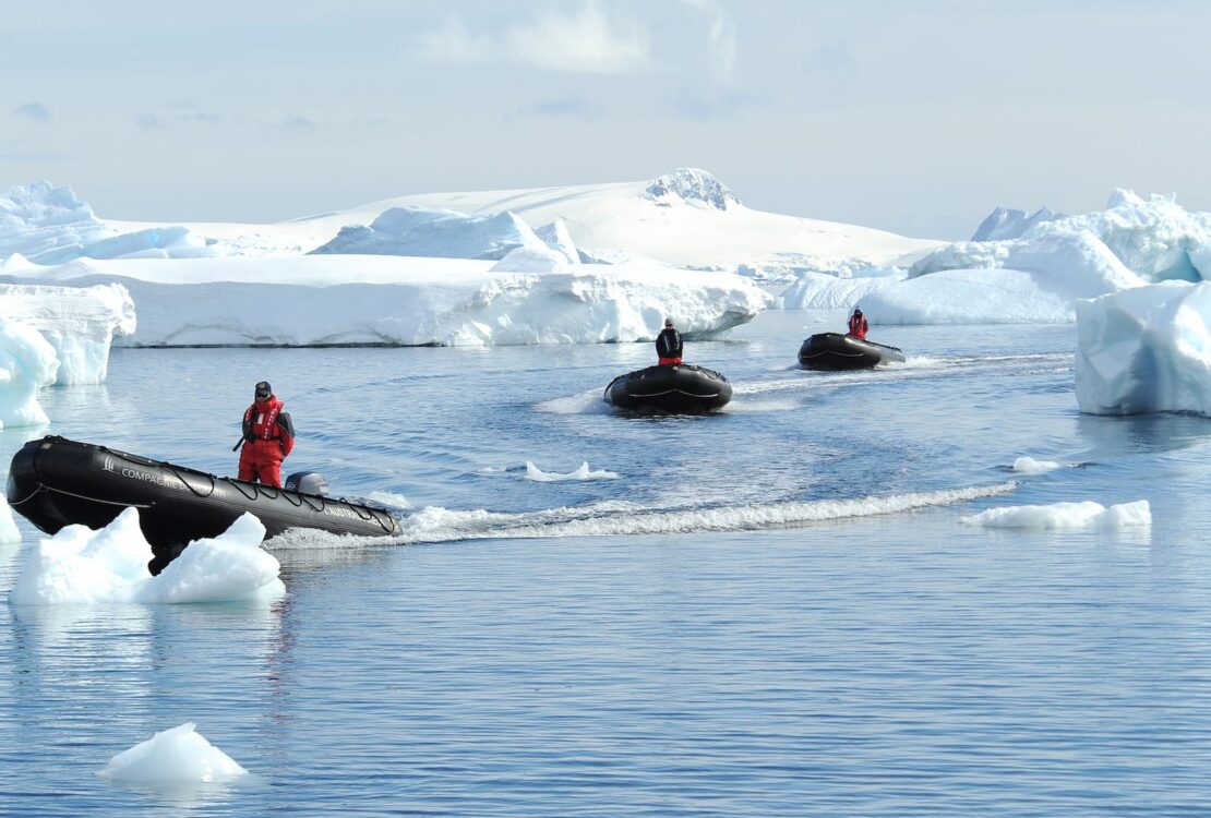 Smithsonian Journeys and Ponant zodiacs driving through icebergs
