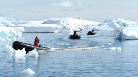 Smithsonian Journeys and Ponant zodiacs driving through icebergs