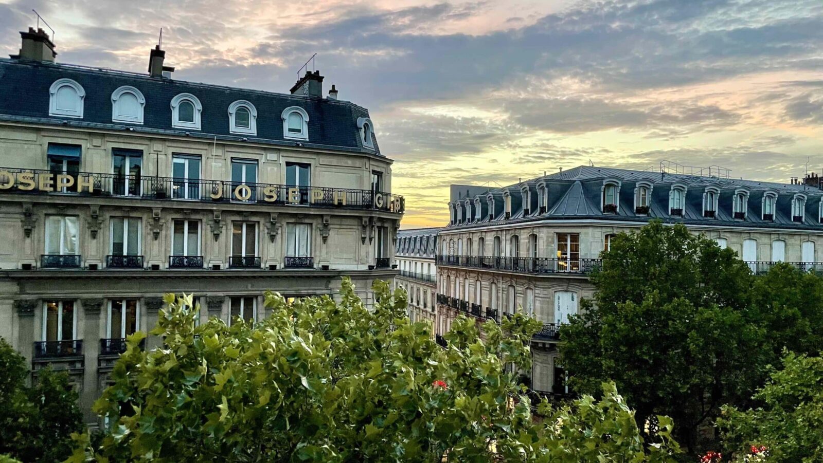 view out over buildings in Paris at dusk