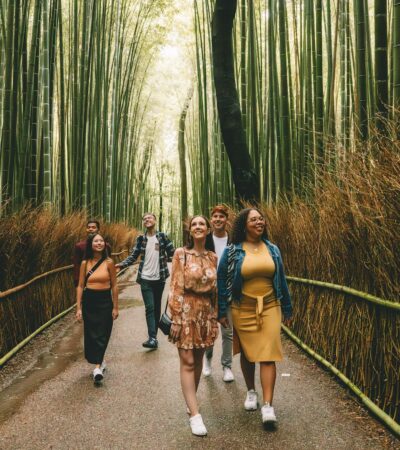 Young travelers on a Contiki tour of Japan in a bamboo forest