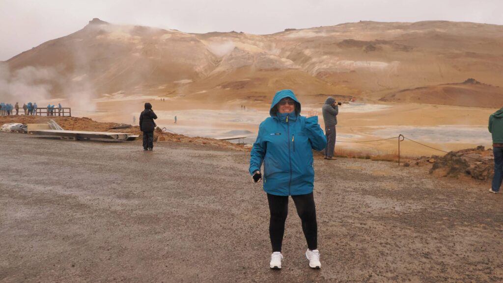 Megan's mom in front of brown mountains in Iceland