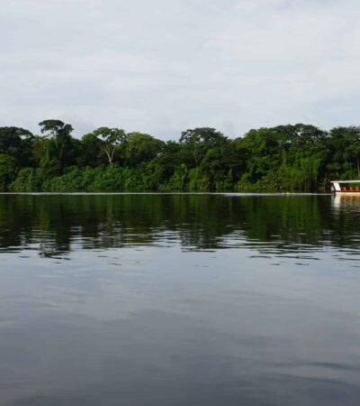 boat on river in tortuguero national park in costa rica on a trafalgar tour