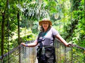 A woman standing on a rope bridge at the Arenal Volcano in Costa Rica on a Road Scholar tour