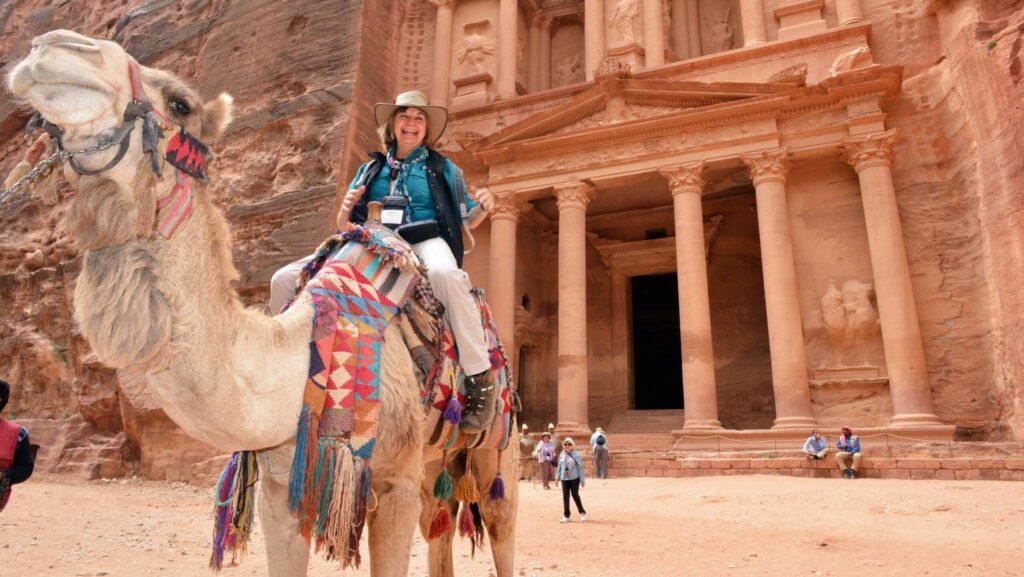A woman on a camel on a Road Scholar tour in Jordan