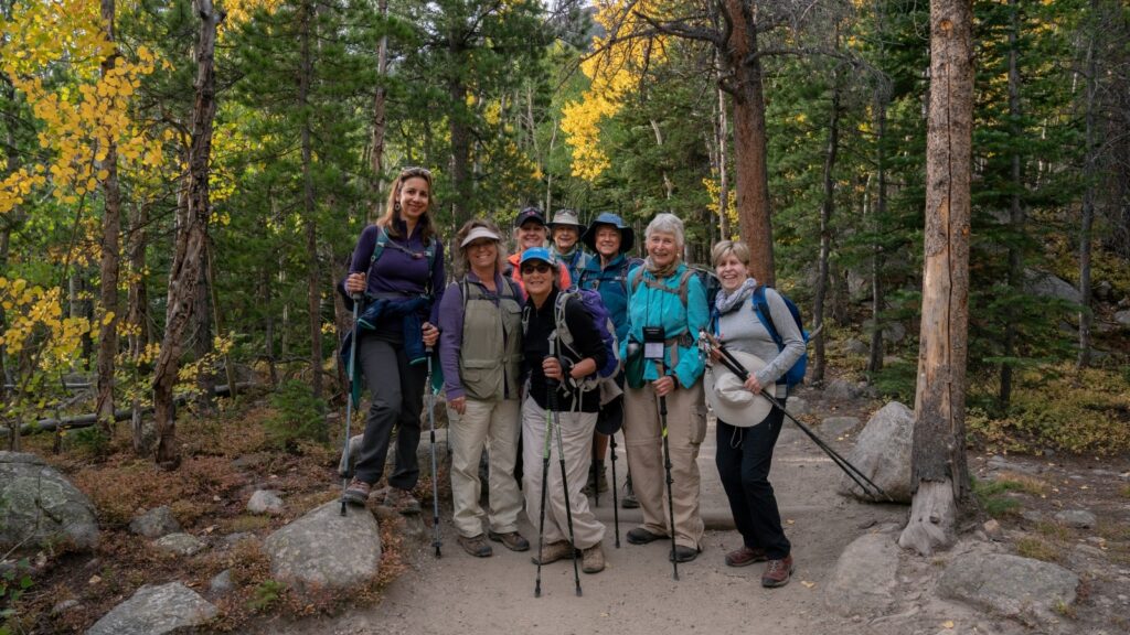 A group of women hiking in the woods in Colorado