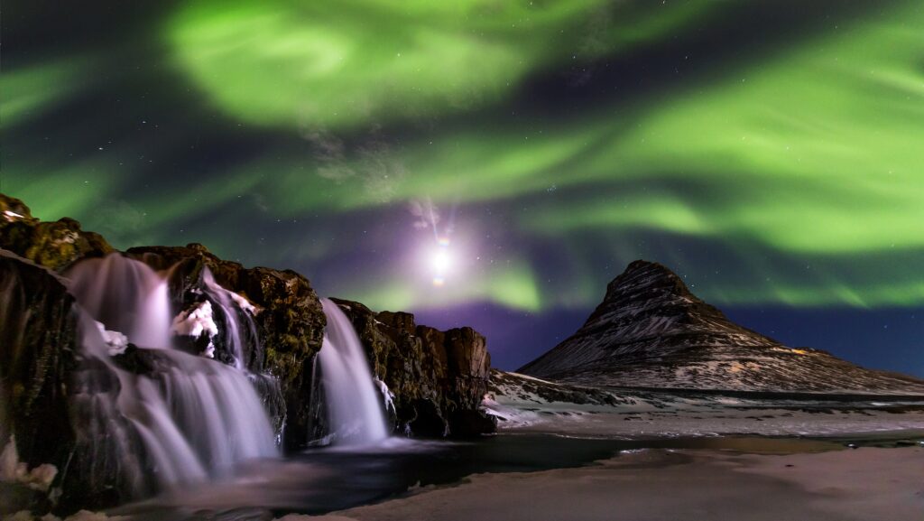 Northern Light, Aurora borealis at Kirkjufell in Iceland. Kirkjufell mountains in winter