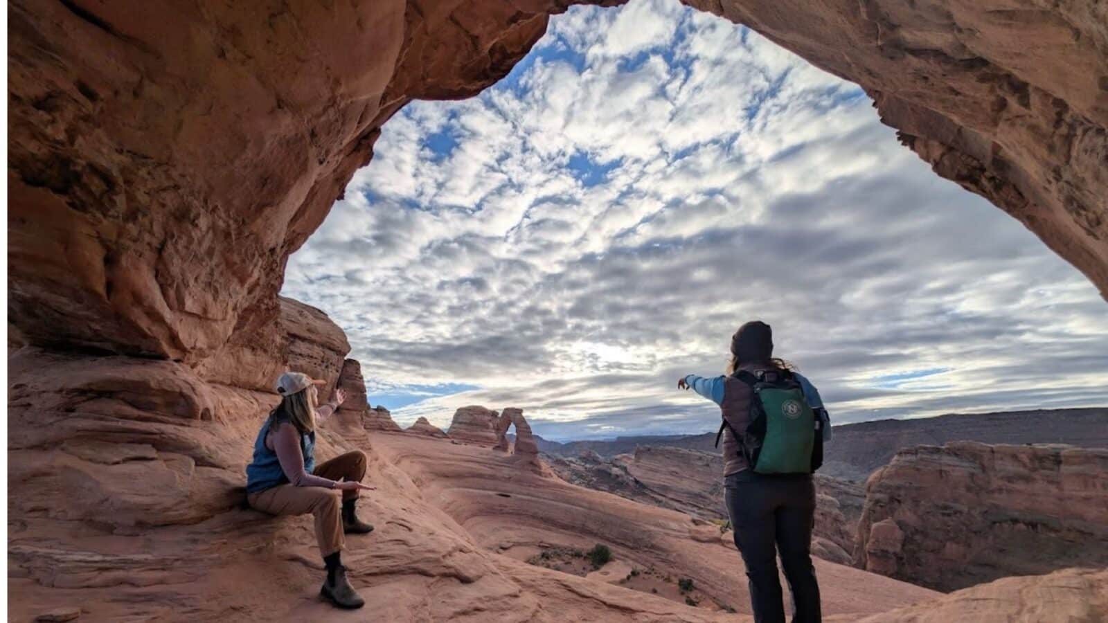 two hikers at Arches National Park