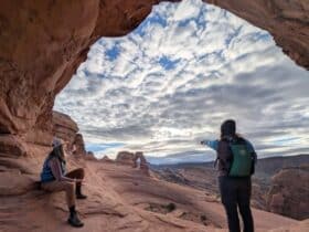 two hikers at Arches National Park