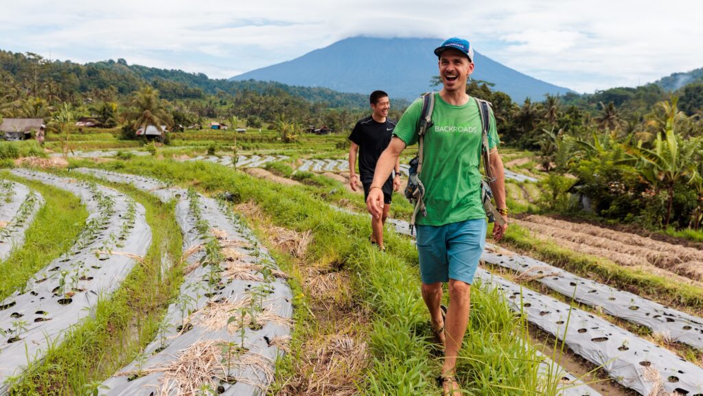 people walking through a wet field on a Backroads trip