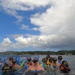 Large family on snorkeling day trip in Honduras