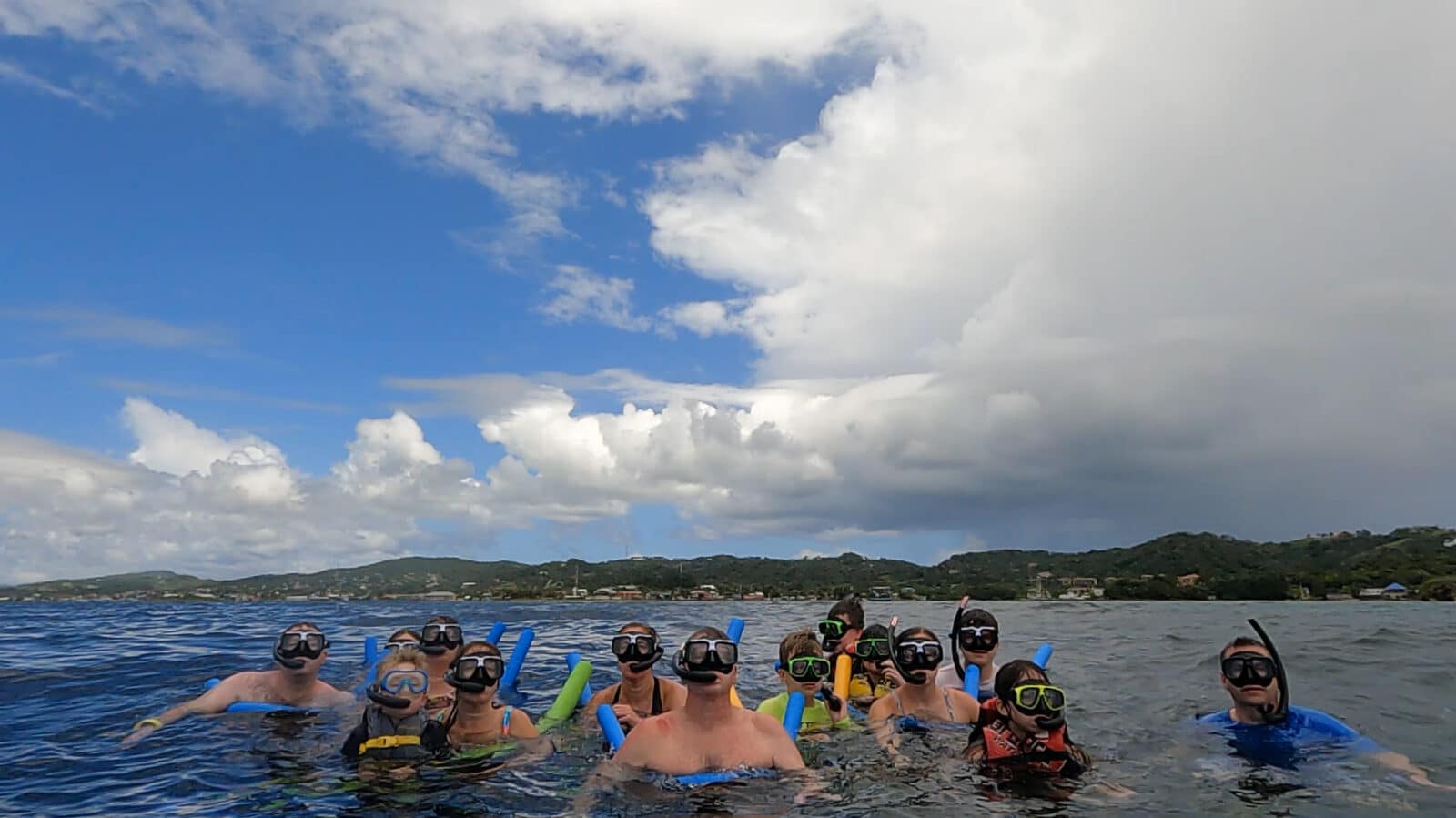 Large family on snorkeling day trip in Honduras