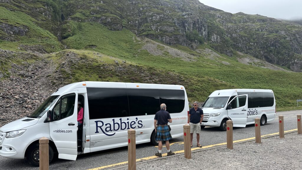 Tour vans and driver-guides on a Rabbie's Tour in Scotland