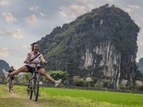 A woman riding a bike on a G Adventures tour in Vietnam
