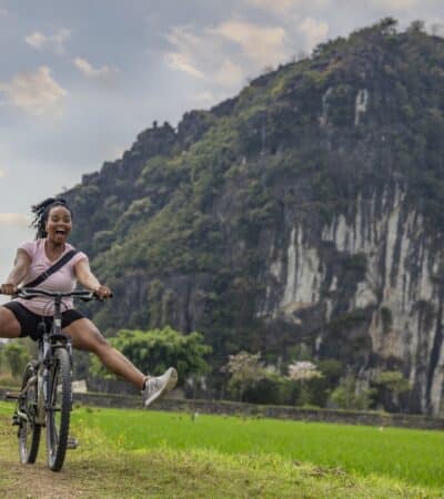 A woman riding a bike on a G Adventures tour in Vietnam