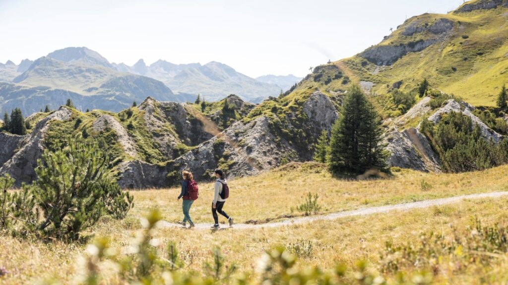 Two women on a hiking trail in the Austrian Alps on a Backroads women-only tour